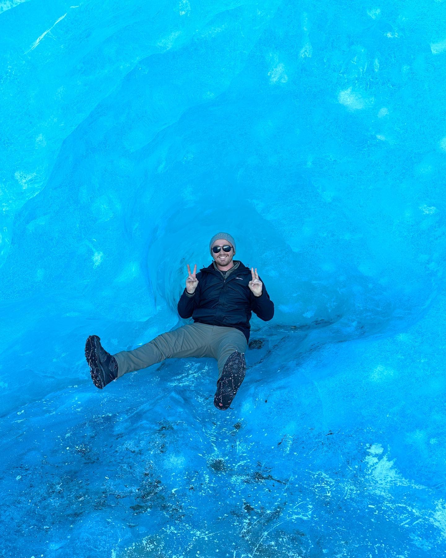 Glacier Cave- This is a picture of me in an iceberg in March when Mendenhall lake was still completely frozen.